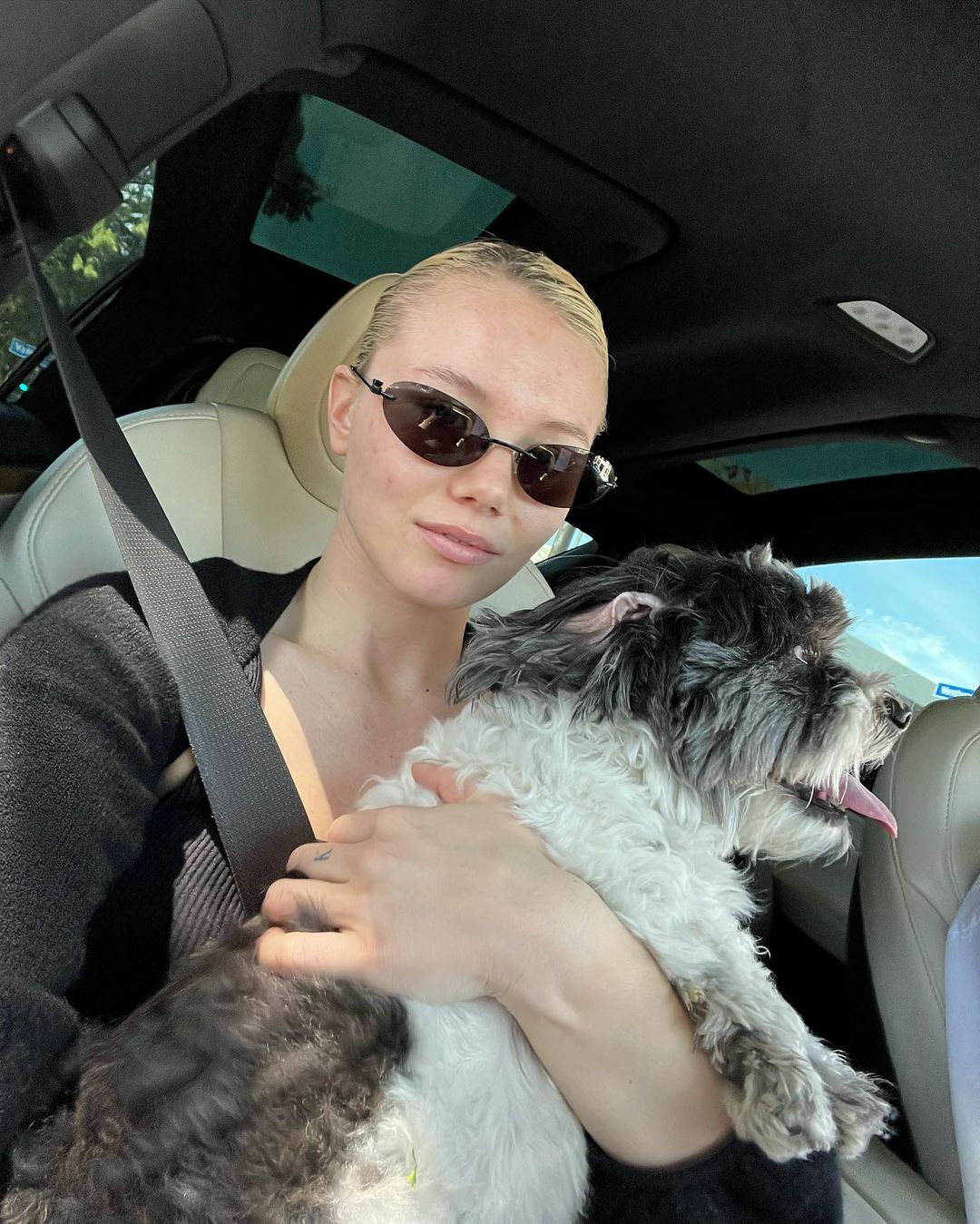 Monica Corgan in car with dog