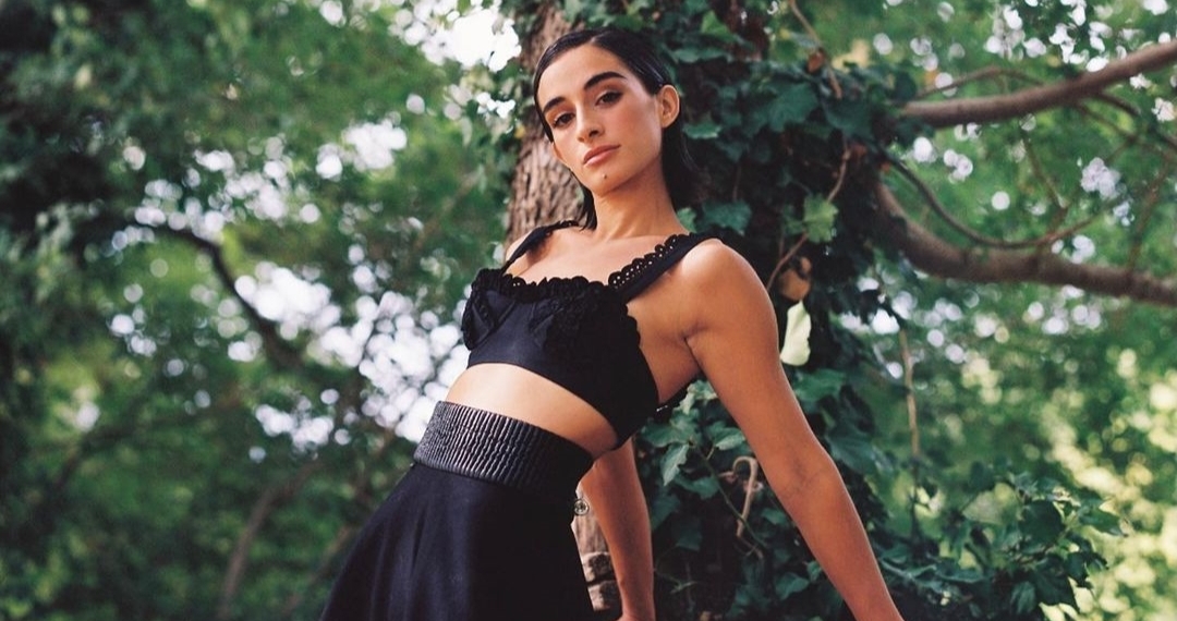 Michela De Rossi in black top and skirt