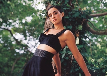 Michela De Rossi in black top and skirt