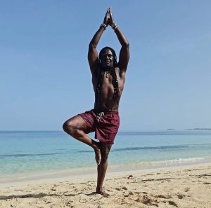 Levi Roots doing yoga