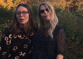 Melanie Lynn Clapp with daughter at a wedding