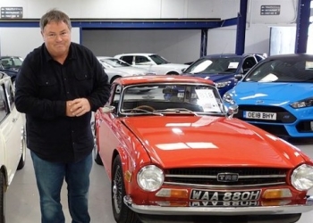 Mike Brewer with a classic red car in auction