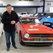 Mike Brewer with a classic red car in auction