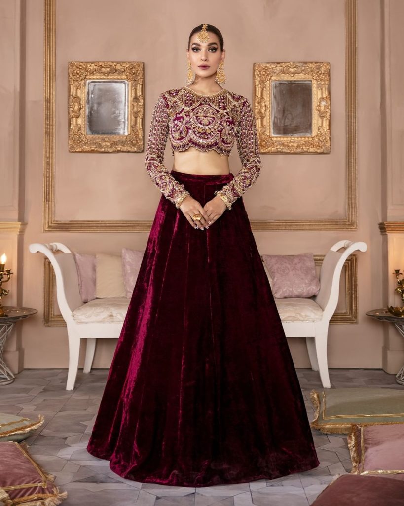 Model wearing a red lehenga from the Kanwal Malik Official Collection