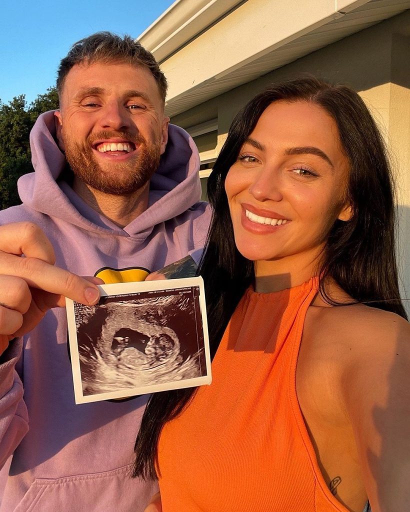 Kristen Hanby and Jasmine Brownsword with the sonography picture of their baby